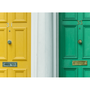 Yellow front door with neighbouring green front door