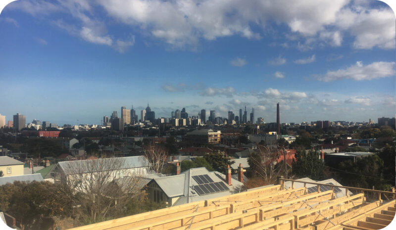 View of Melbourne from Clifton Hill, with plumbing in the foreground