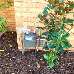 Gas Meter with regulator installed in suburban front yard