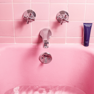 Pink tiles and pink bath