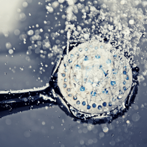 Close up of water coming out of shower head